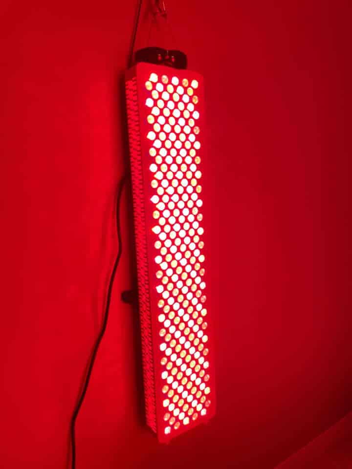 A Kala red light therapy device in a modern living room.