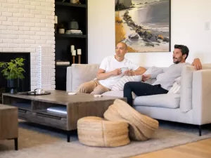 a man is sitting with is friend enjoying the orion pro 600 2.0 review