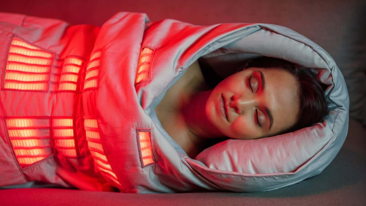 A woman using the best sauna blanket
