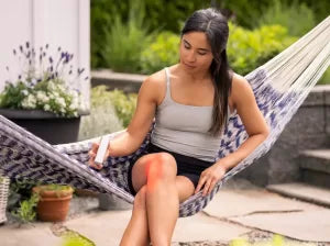 a woman using the orion orion edge 2.0 in our red light therapy reviews