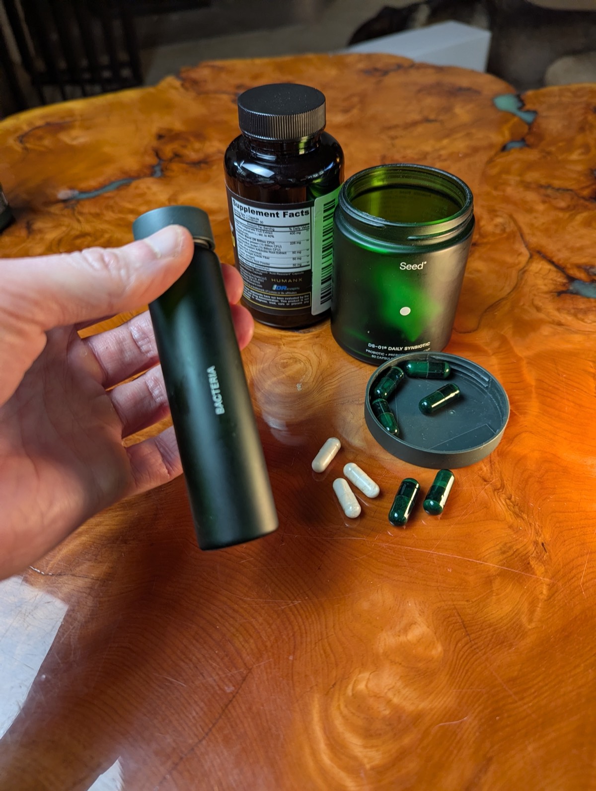 daryl hold seed probiotic jar with probiotic in the background