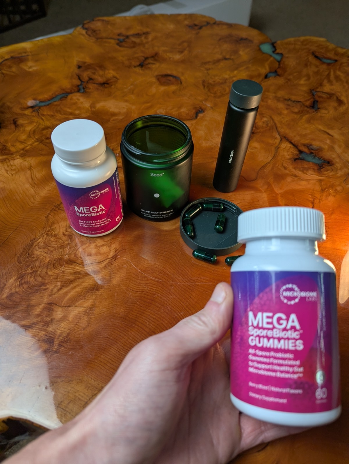 daryl holding megasporebiotic gummies with seed in the background