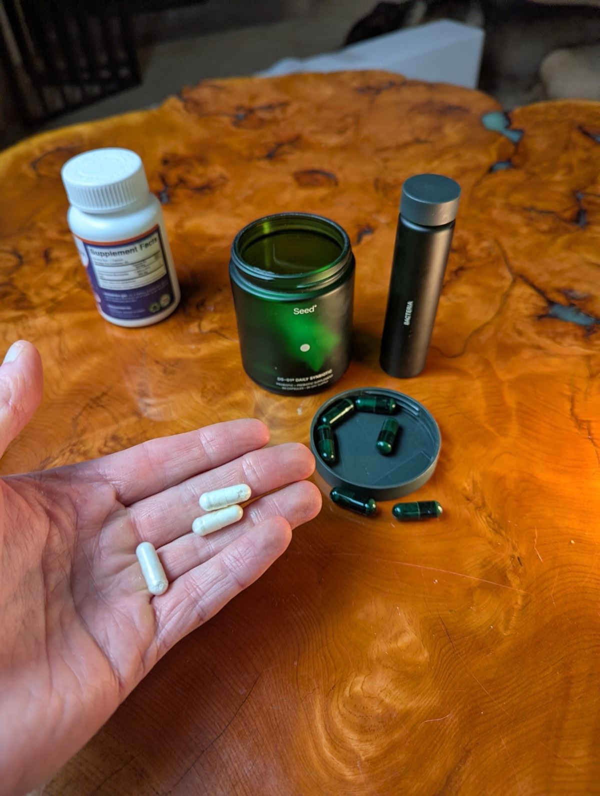 daryl holding probiotic with seed in the background