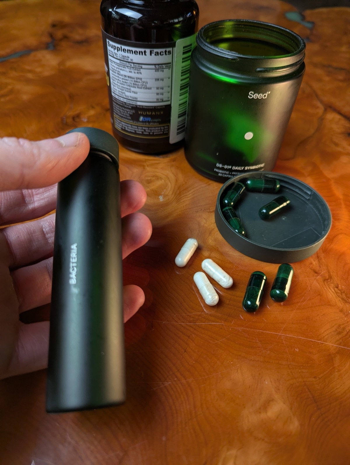 daryl holding seed ds 01 jar with probiotic in the background