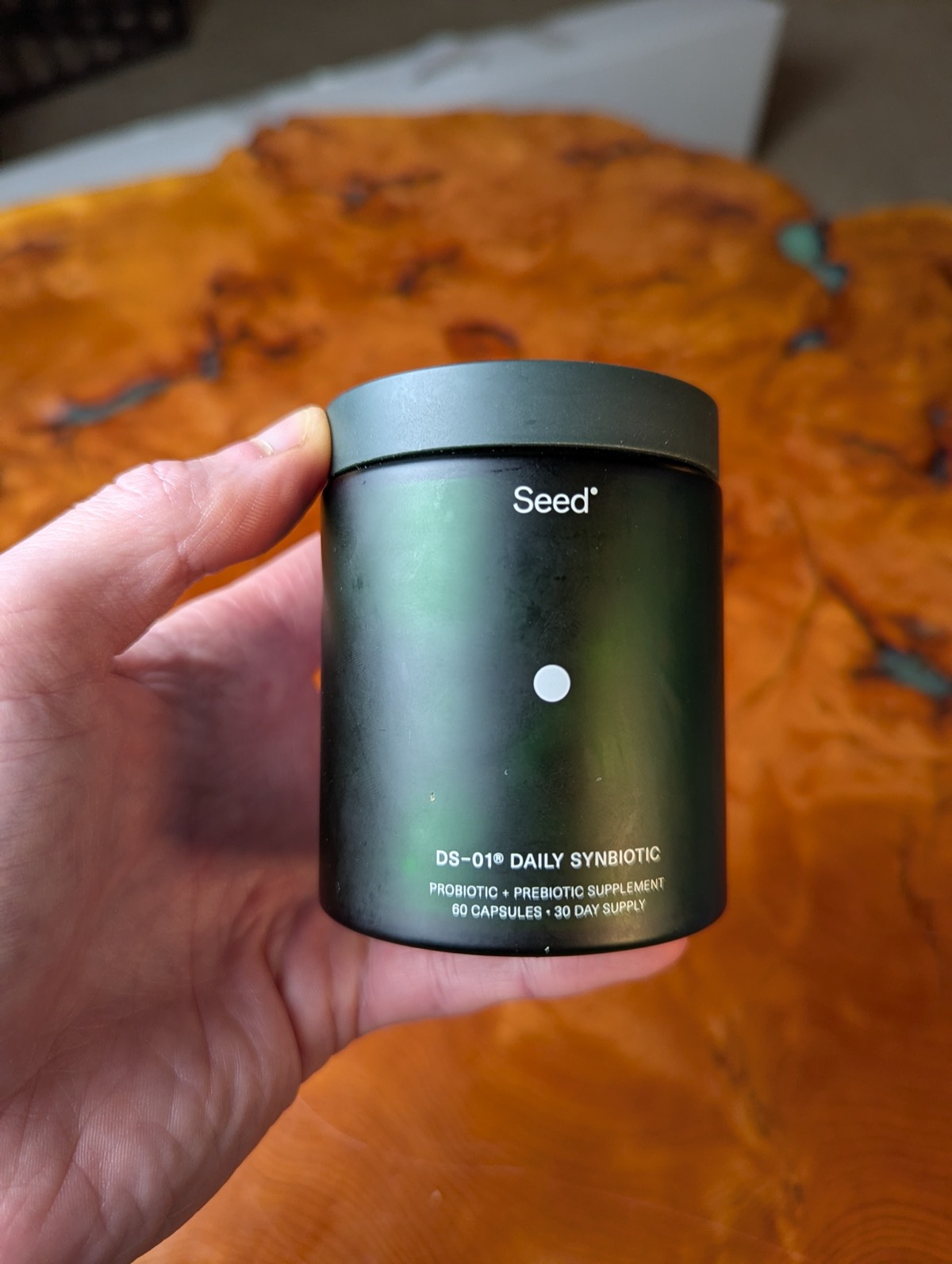 daryl holding seed probiotic jar front 