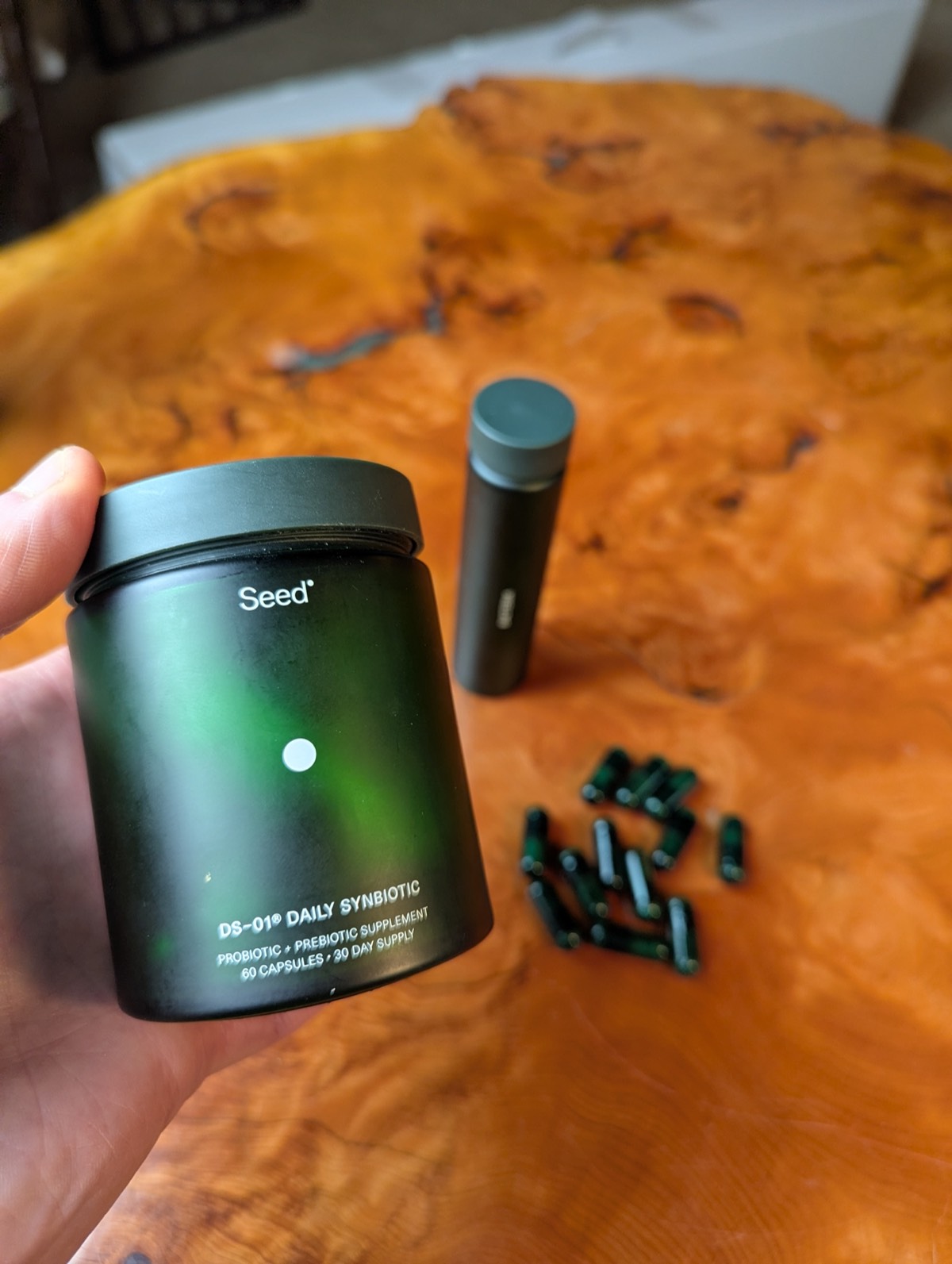 daryl holding the jar of seed probiotics