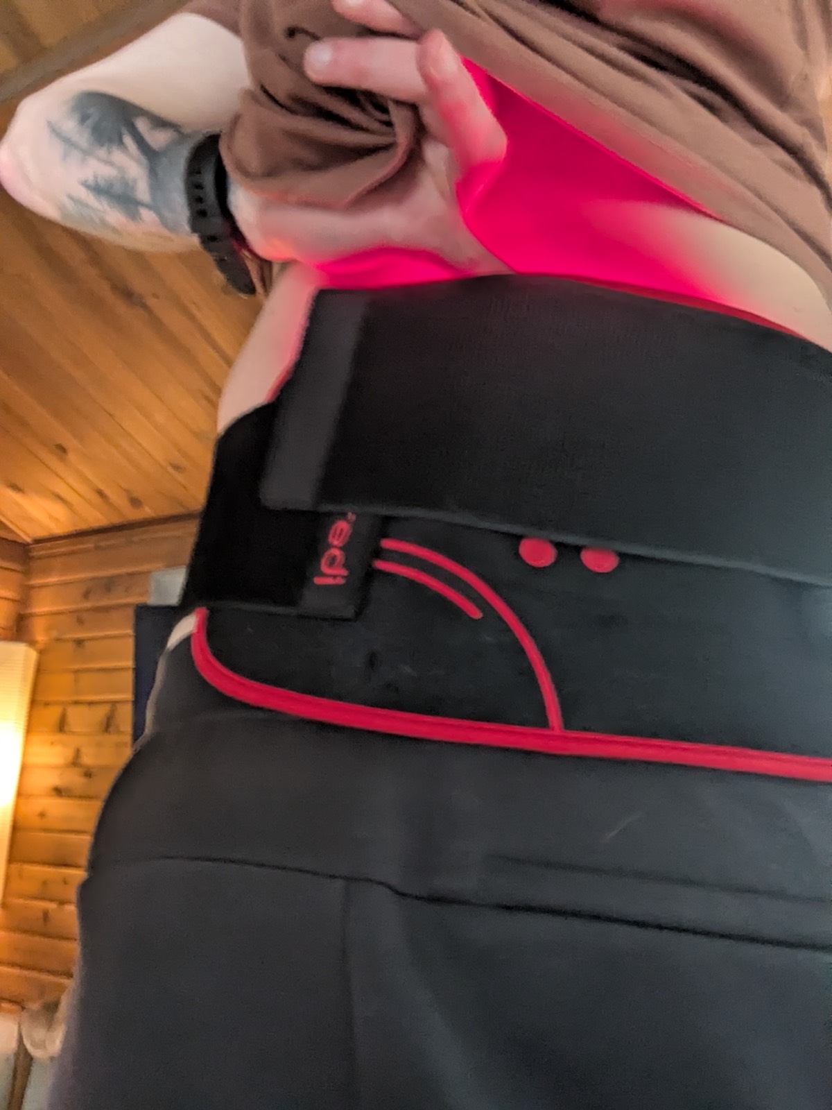 daryl showing a red light therapy back pain belt off 