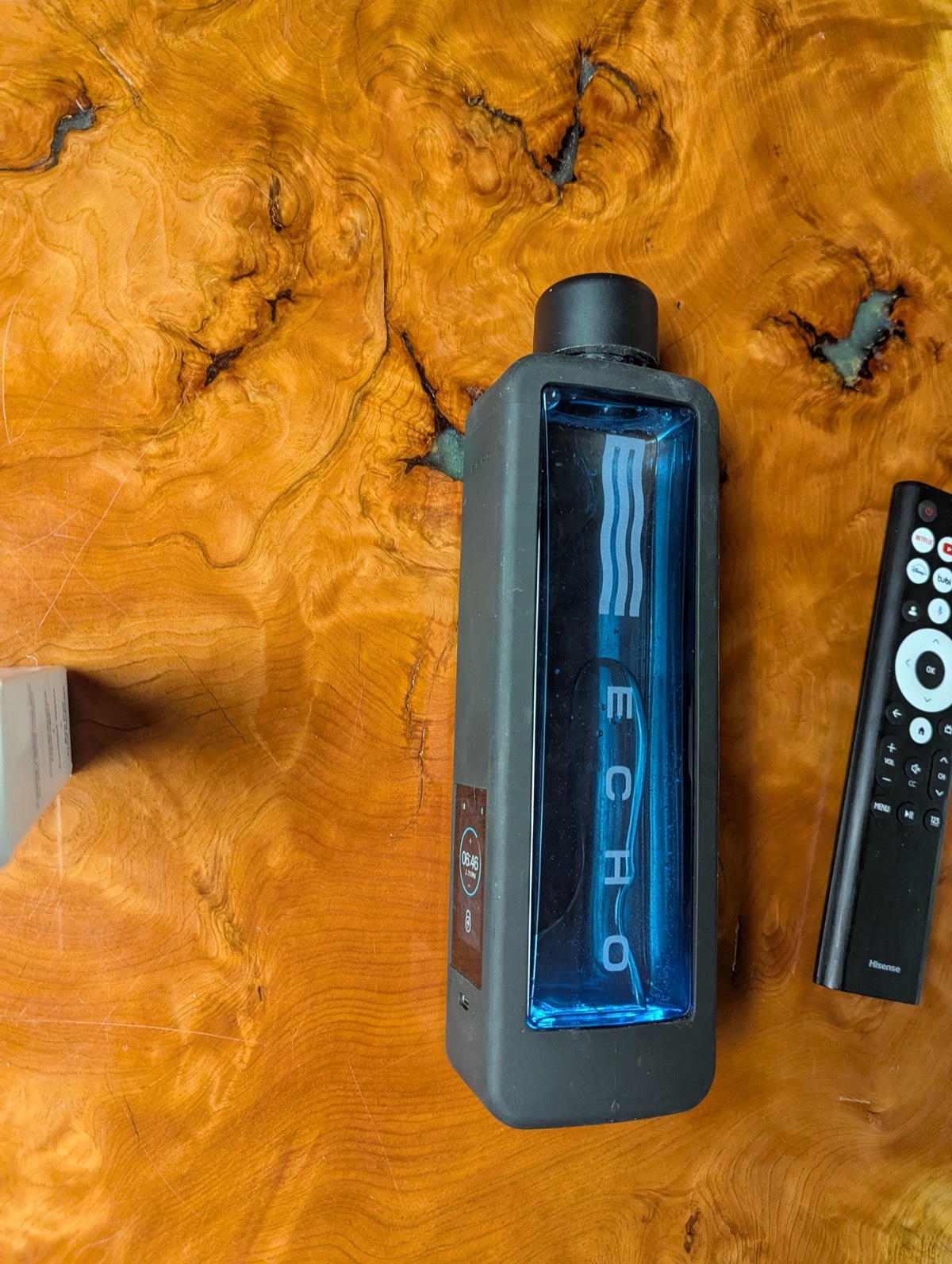 echo h2 bottle next to a remote for a size comparison