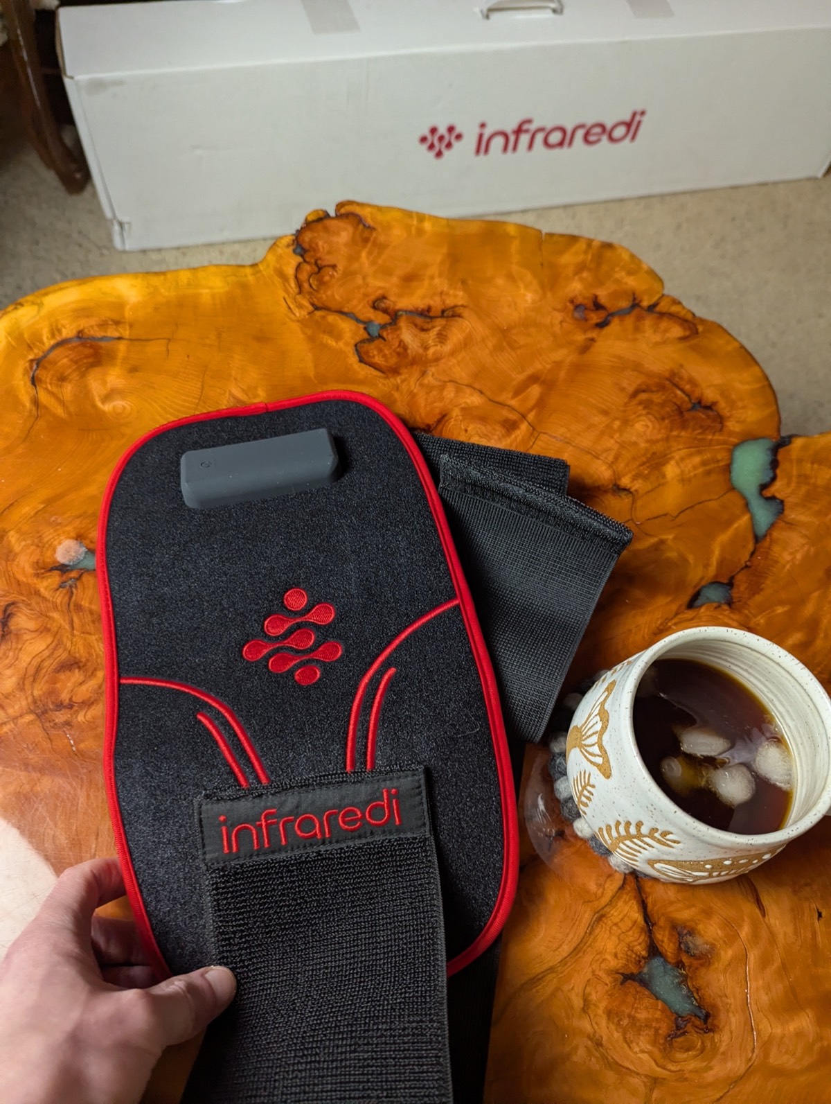 holding the inraredi red light therapy joint wrap with my infraredi flex max review