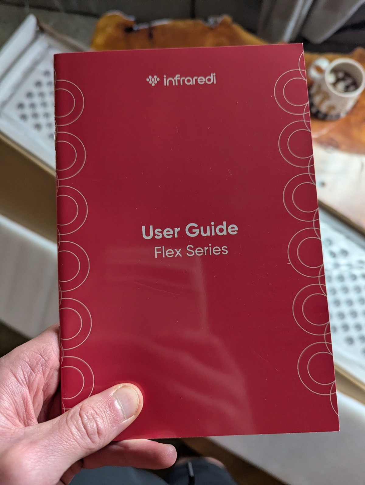 infraredi flex manual with the infraredi red light therapy in the background