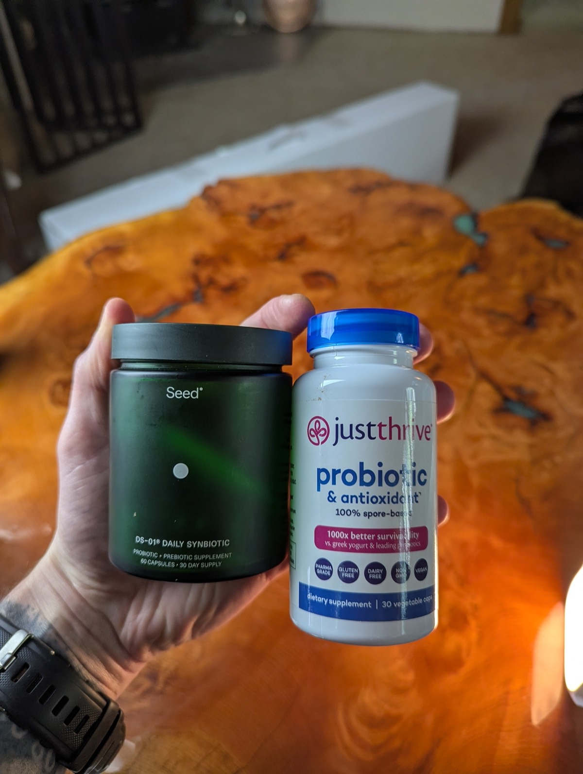 just thrive and seed probiotic in daryls hand