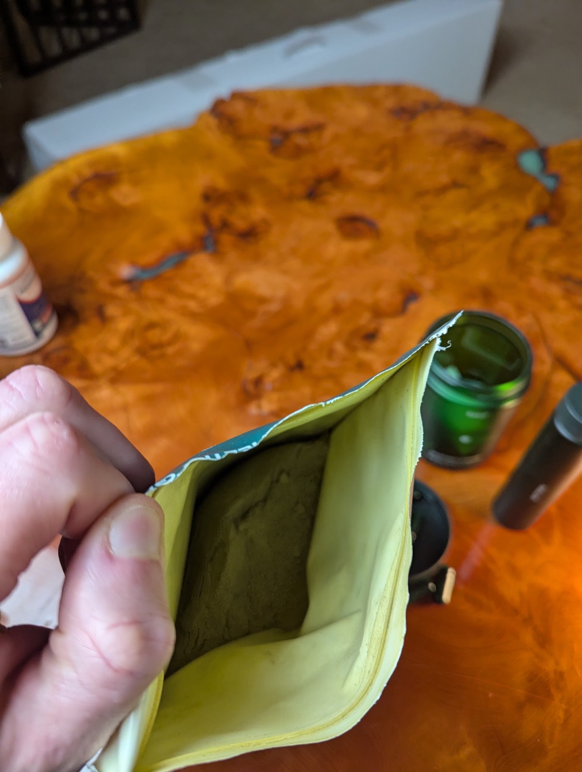 looking inside ag1 bag with seed probiotic in the background