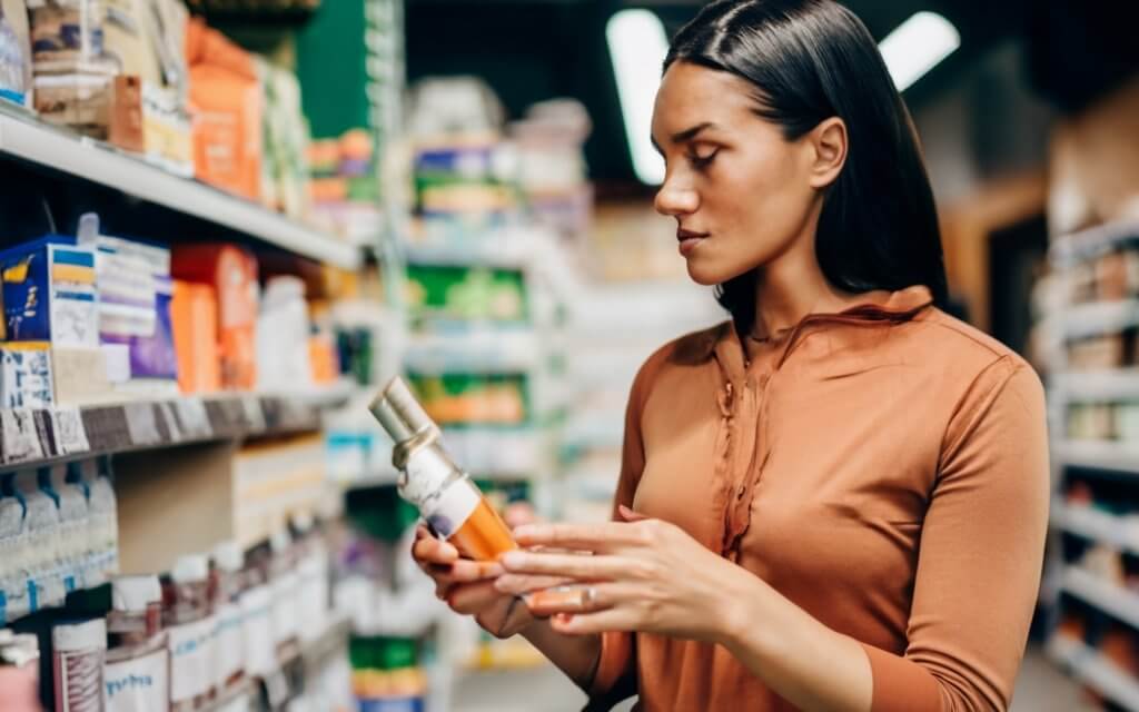 A woman feeling energetic, illustrating the overall wellness benefits beyond gut health discussed in this Ritual Synbiotic+ review.