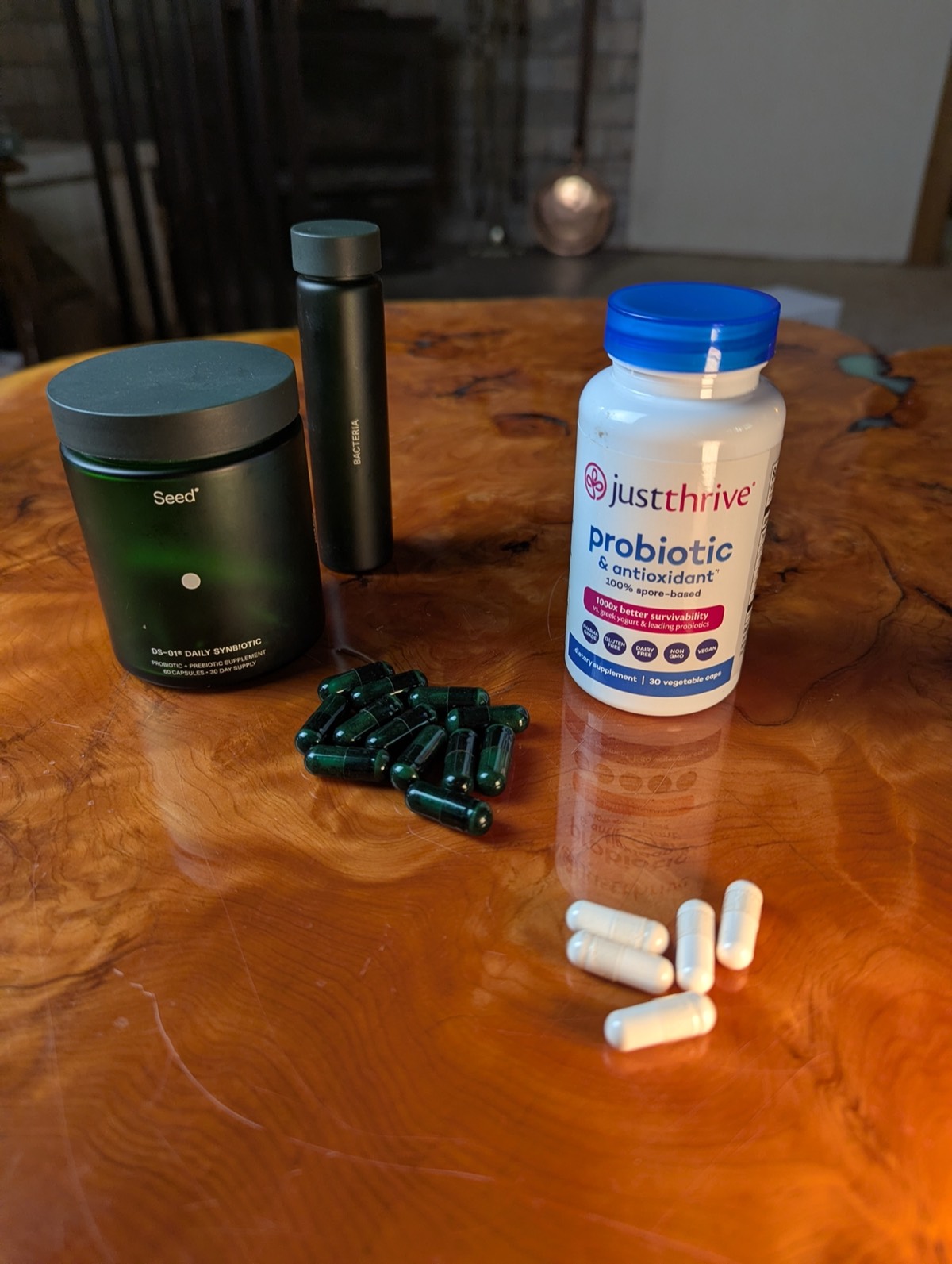 seed ds o1 and just thrive probiotic on a coffee table for review