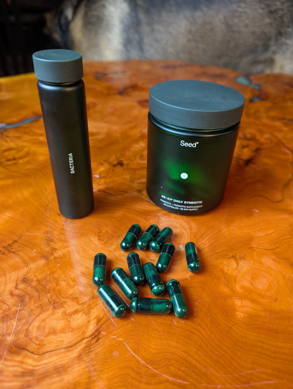 seed probiotics open on a table with jars by the side