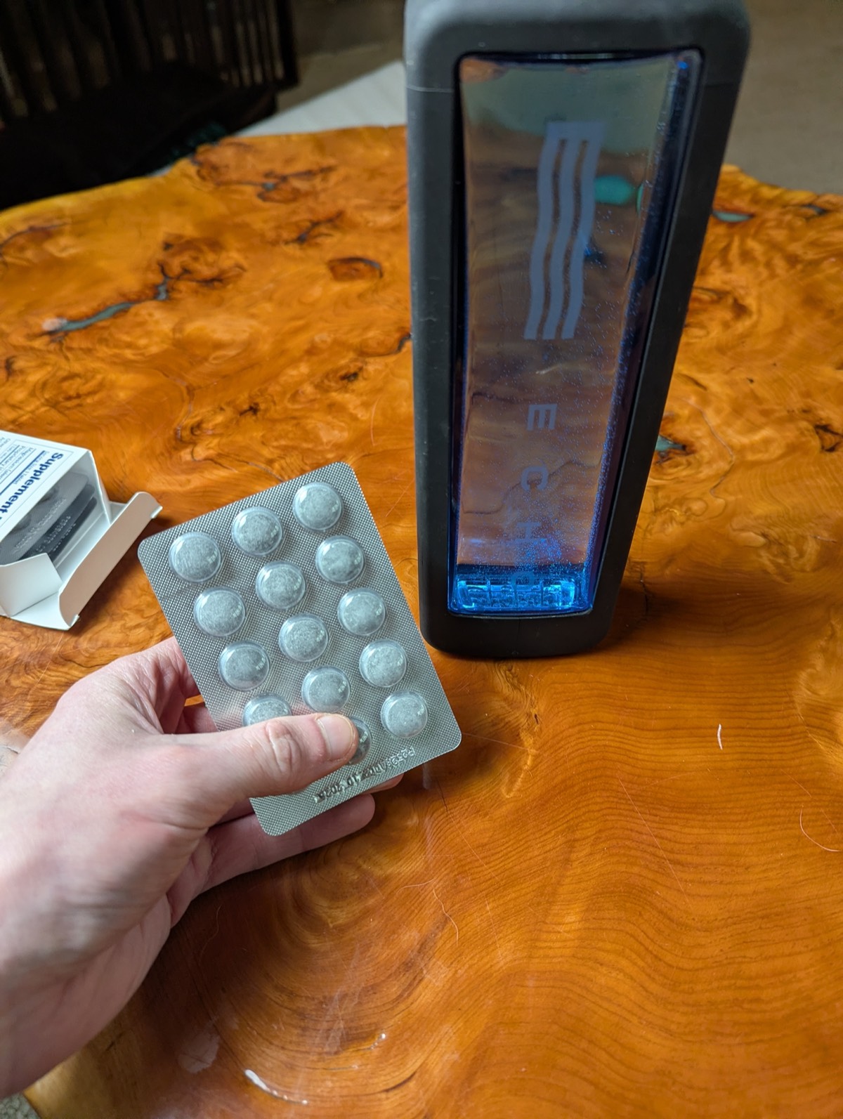 showing off hydrogen water tablets and  a echo hydrogen water bottle