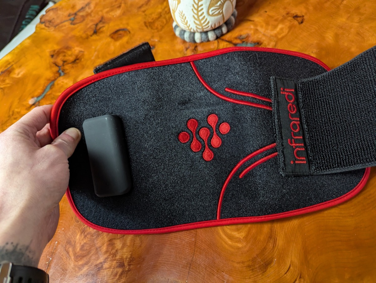 showing off the infraredi red light therapy knee brace