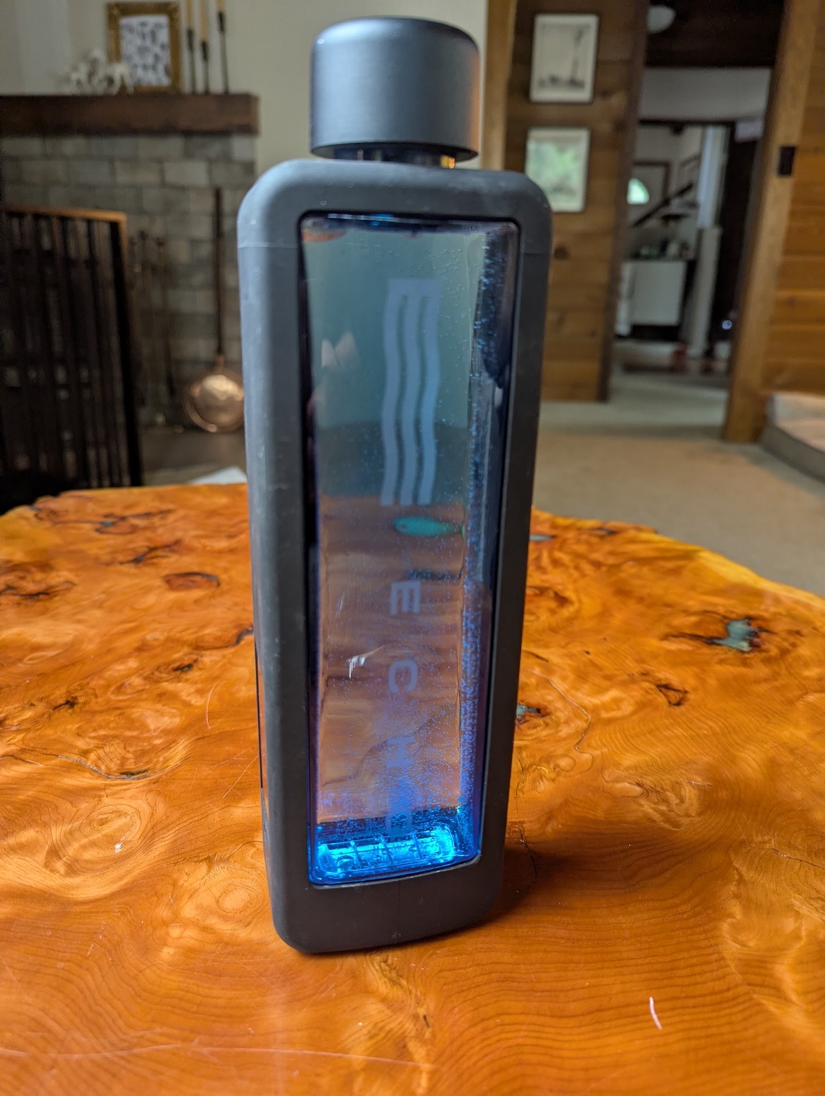 the echo hydrogen water bottle on a coffee table