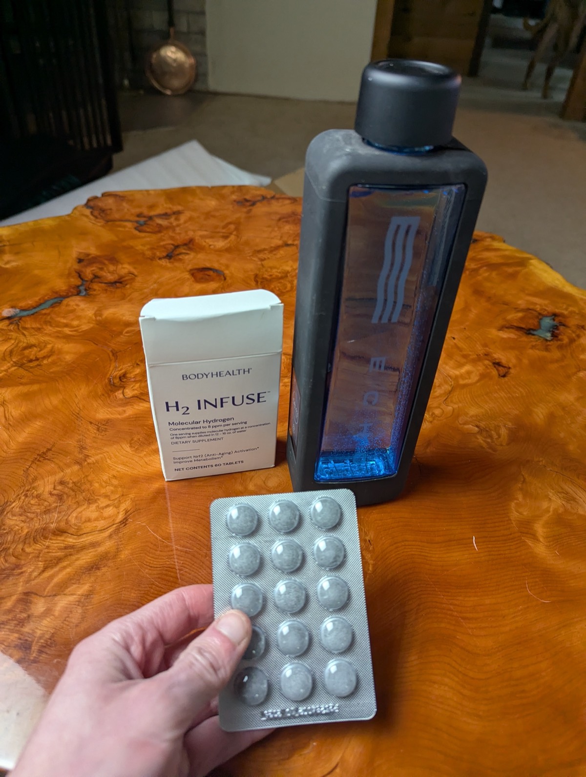 the echo hydrogen water turned on with the hydrogen tablets beside it