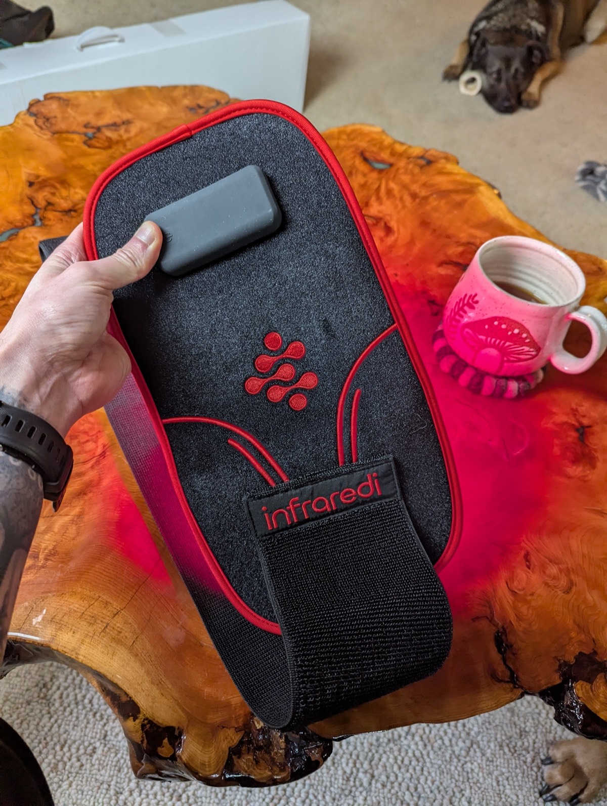 the red light therapy knee brace turned on and glowing