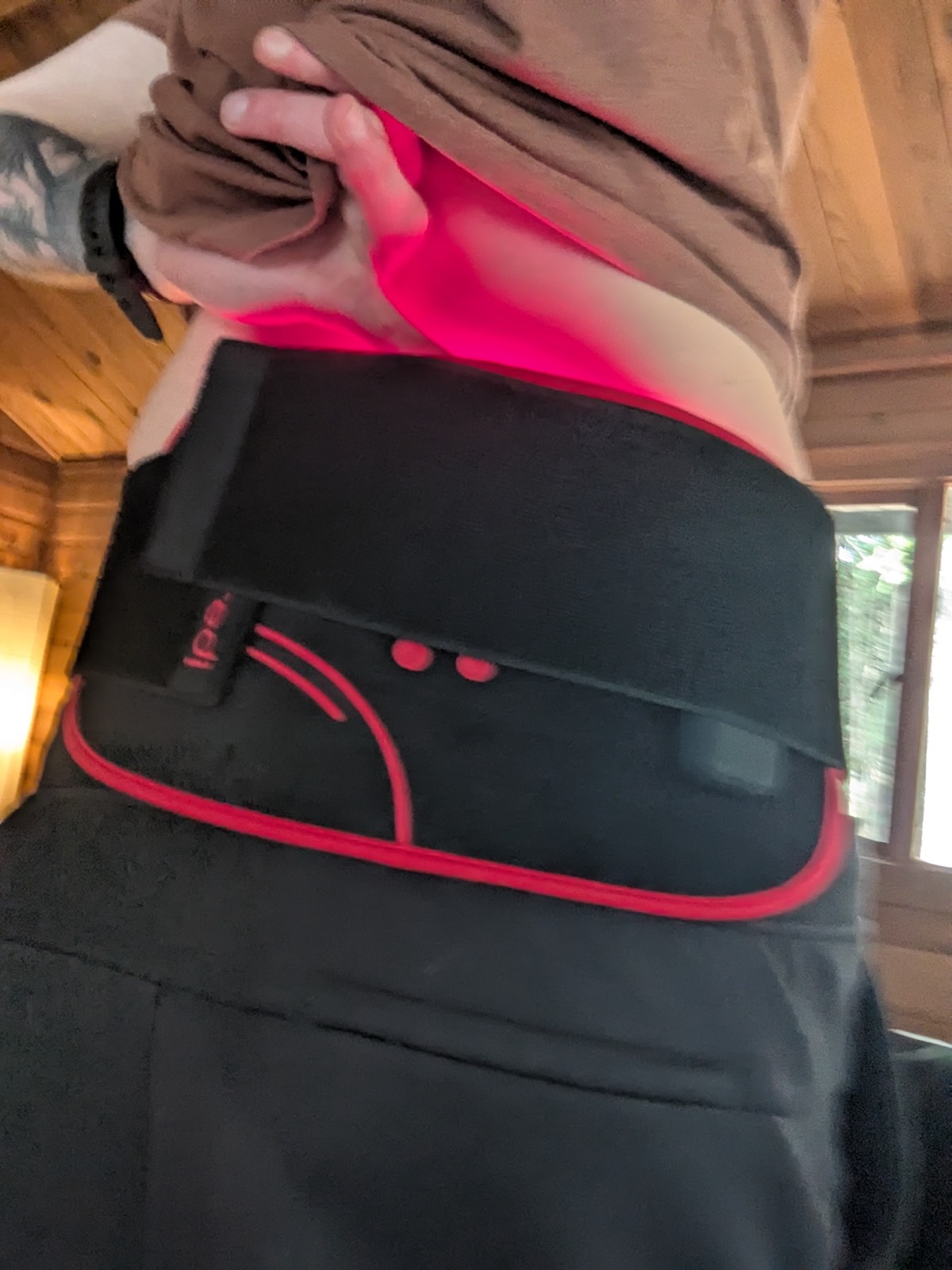 wearing a red light therapy belt for back pain and inflammation 