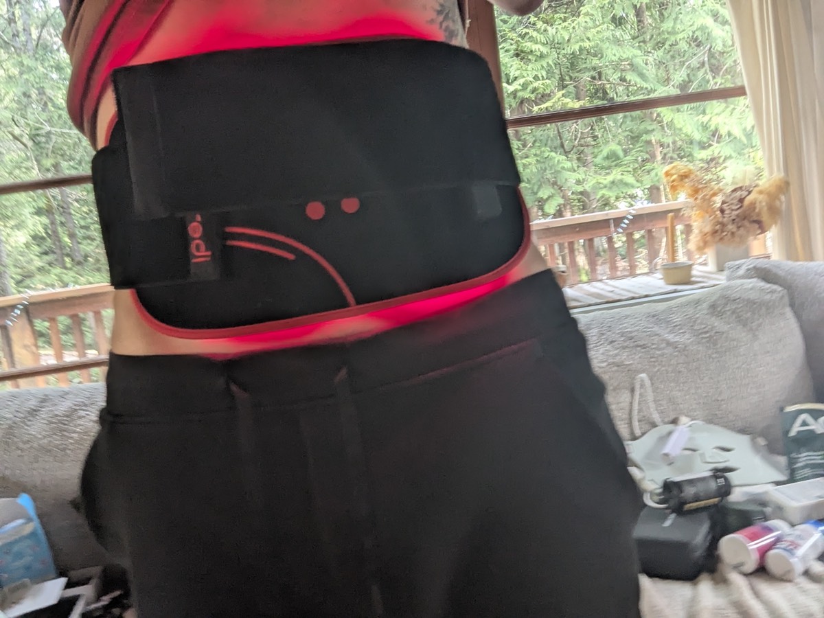wearing a red light therapy belt on my stomach