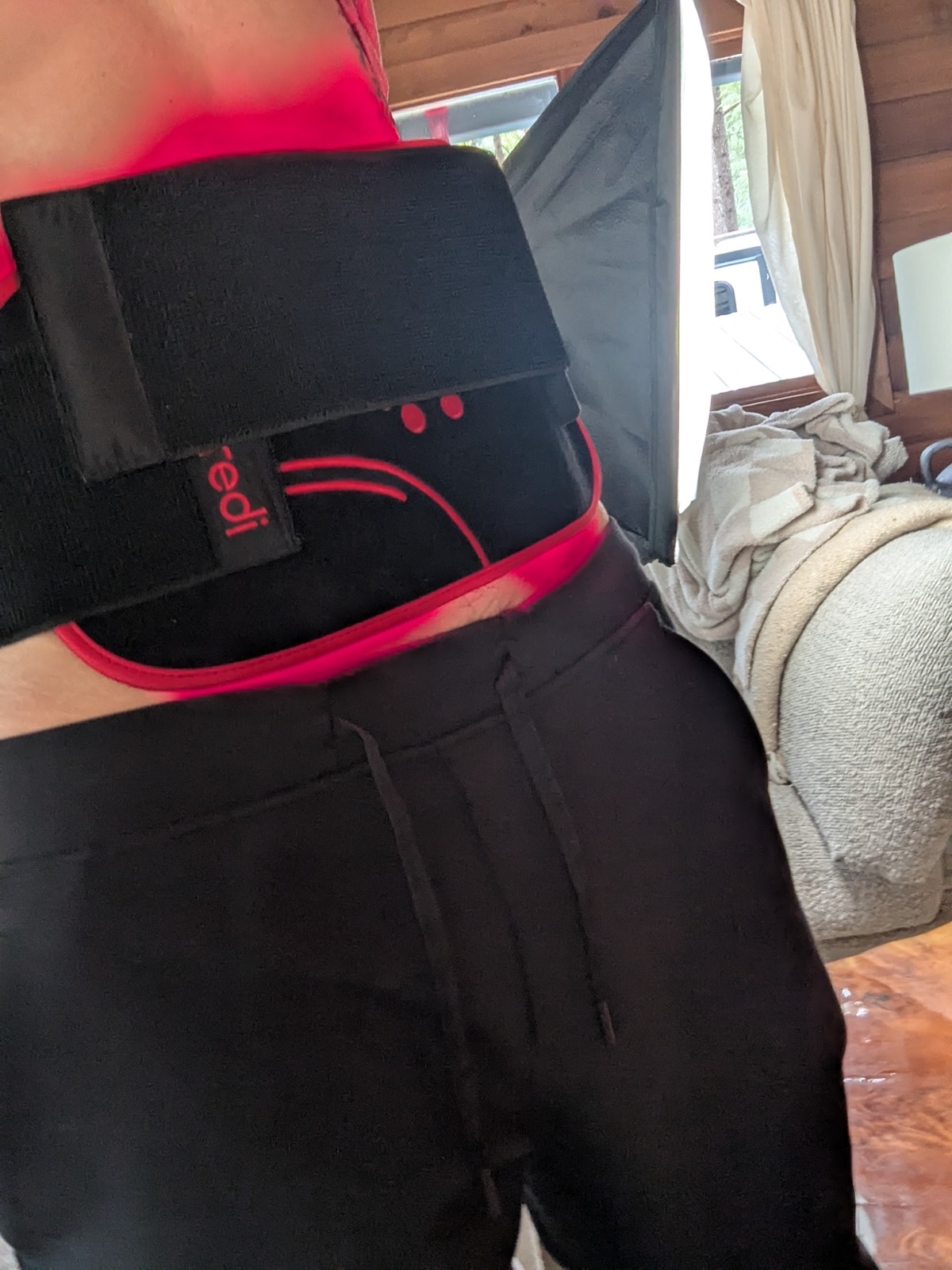 wearing a red light therapy pad on my stomach 